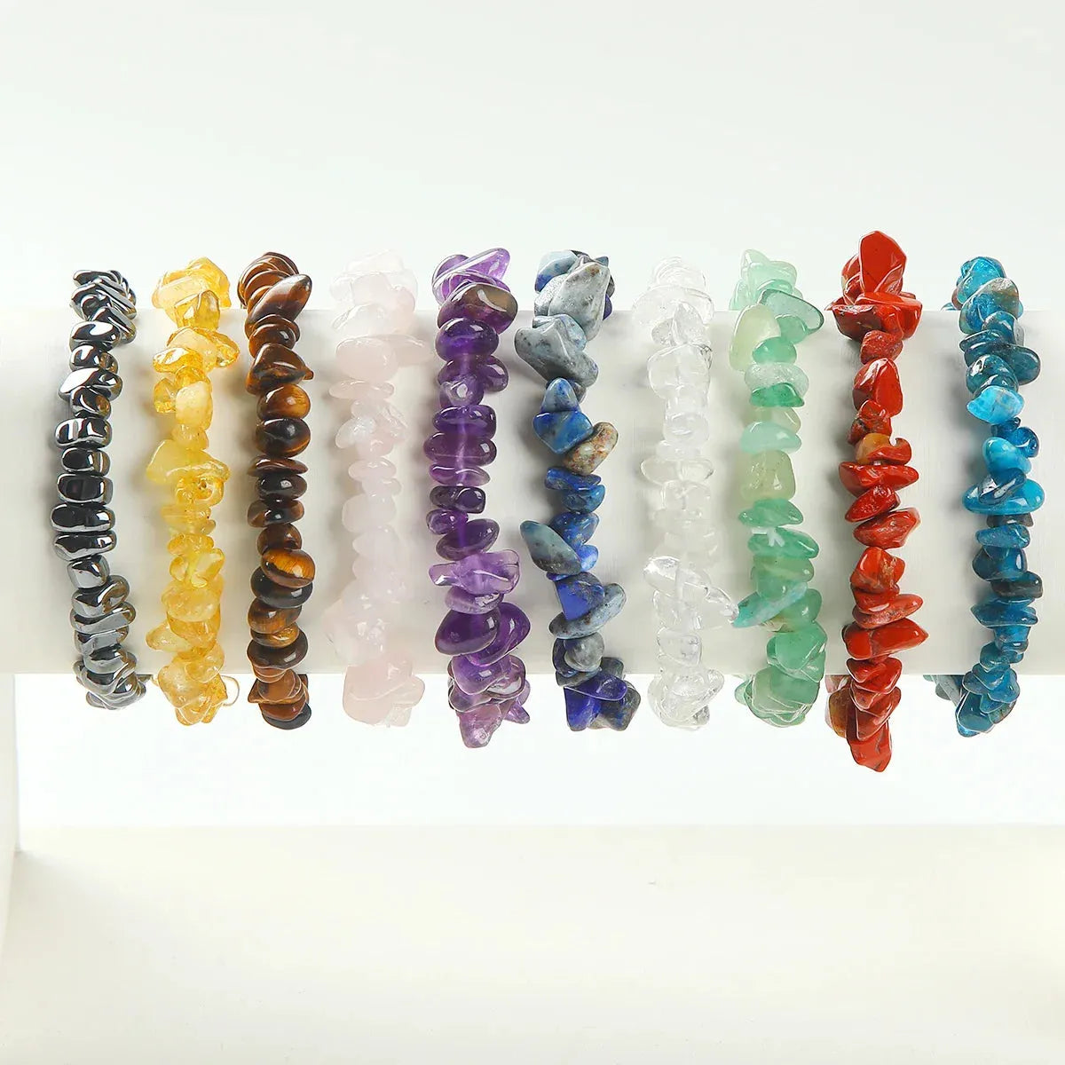 Set of colorful chip bracelets on a white background