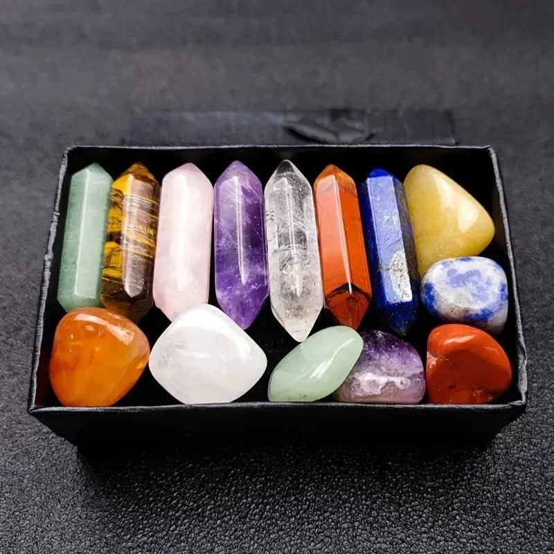 Box of multicolored crystals on a dark textured surface