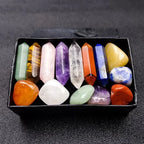 Box of multicolored crystals on a dark textured surface
