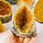 citrine quartz geode crystal cluster held in hand natural druzy stone