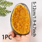 citrine quartz geode crystal cluster with size reference in hand