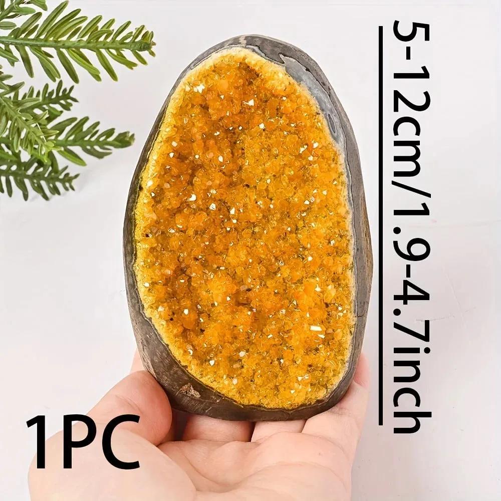 citrine quartz geode crystal cluster with size reference in hand