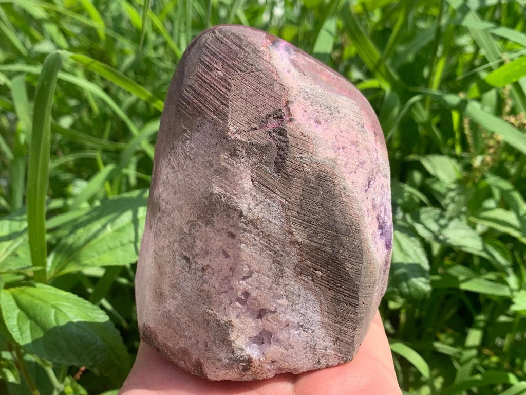 Pink druzy quartz geode crystal cluster back view showing natural stone base