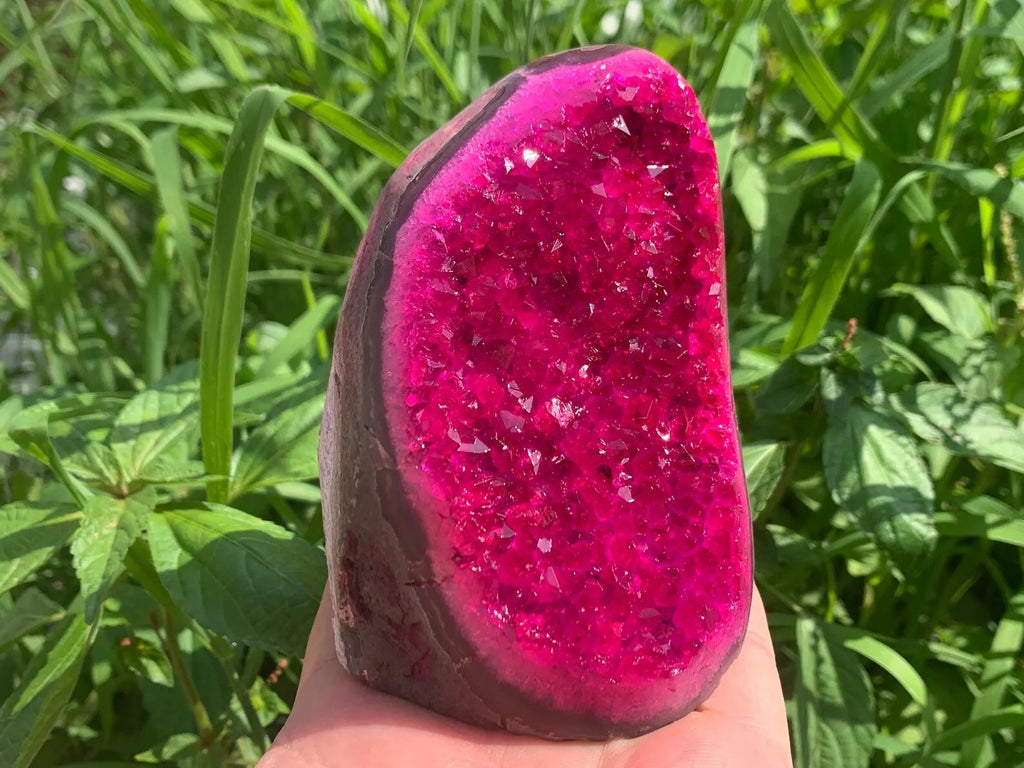 Pink druzy quartz geode crystal cluster front view with natural sparkling crystals