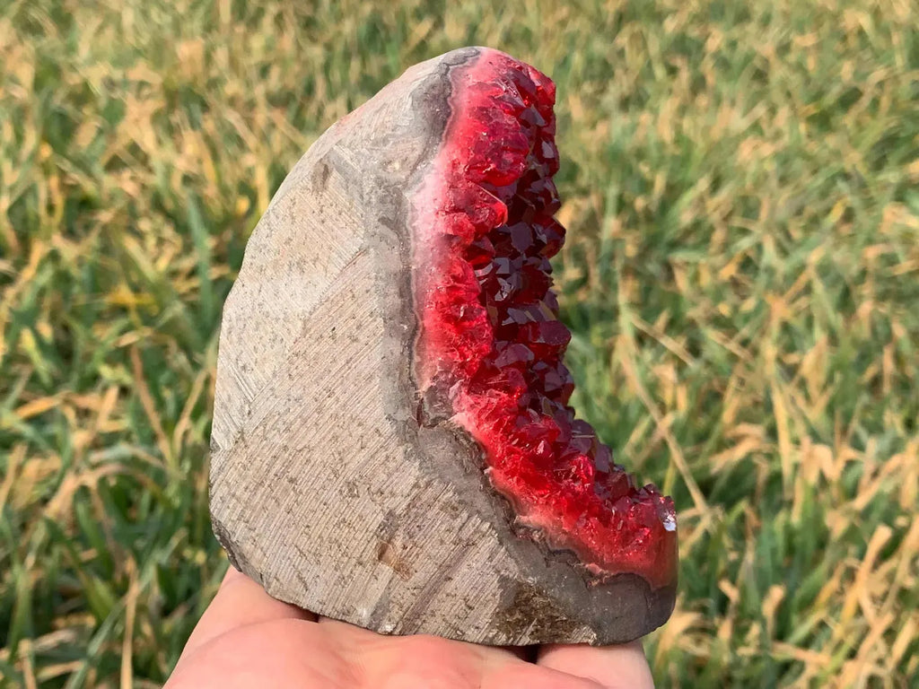 natural stone geode with red druzy crystals side angle