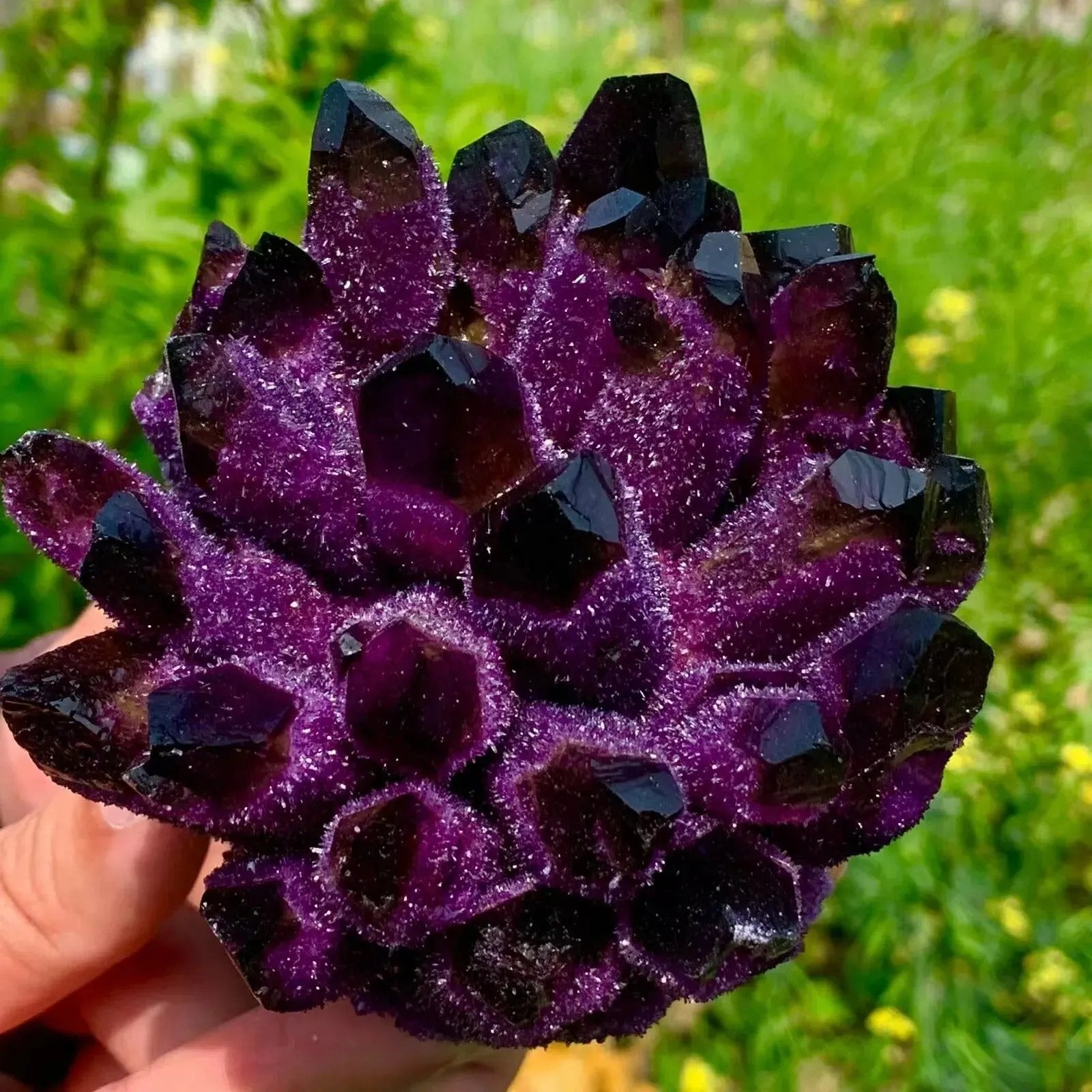 Violet crystal cluster natural stone with dark pointed crystals close view